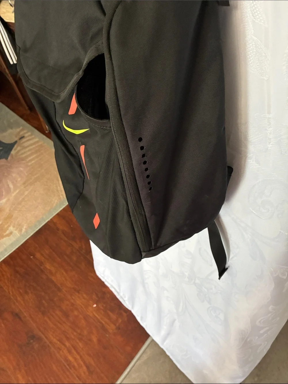 Nike Black Backpack with Neon Yellow Swoosh and Red Stripe Accents